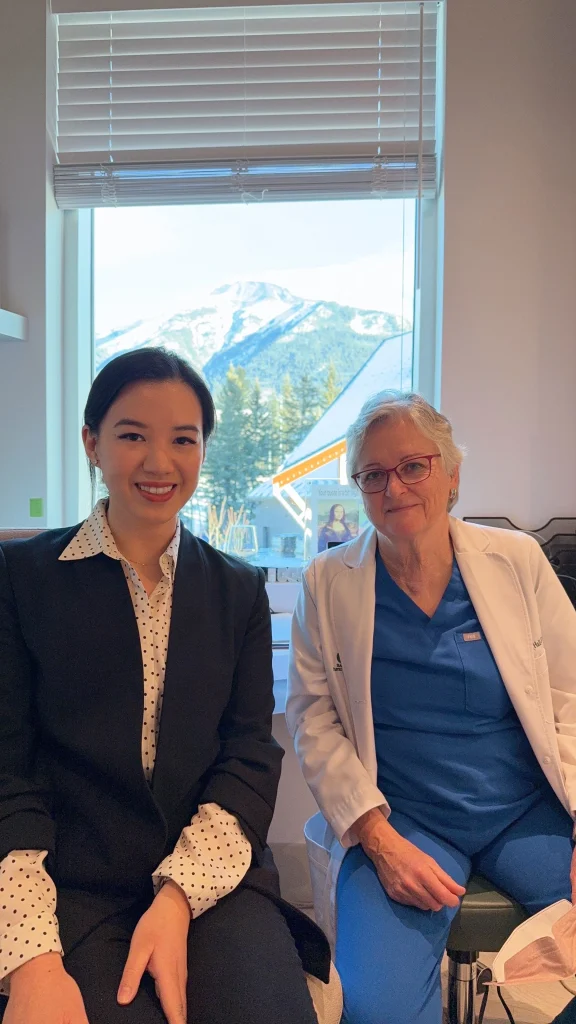 Dr Jen Law with A/Prof Elizabeth Hall-Findlay in her clinic overlooking the mountains of Canmore